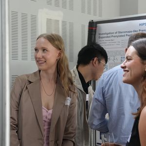 People looking at posters on pinboards